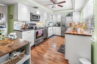 Beautifully remodeled 3-bedroom, 2.5-bath F-model condo with 1 on Palm-Aire Country Club and Resort - Palms in Florida - for sale on GolfHomes.com, golf home, golf lot