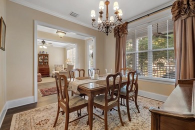 Sitting gracefully on a hilltop corner lot across from the on Southwood Golf Club in Florida - for sale on GolfHomes.com, golf home, golf lot