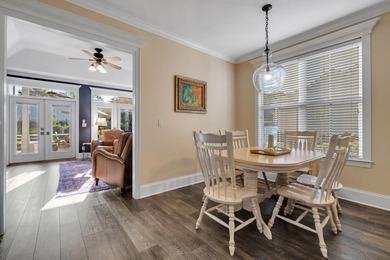 Sitting gracefully on a hilltop corner lot across from the on Southwood Golf Club in Florida - for sale on GolfHomes.com, golf home, golf lot