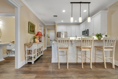 Sitting gracefully on a hilltop corner lot across from the on Southwood Golf Club in Florida - for sale on GolfHomes.com, golf home, golf lot