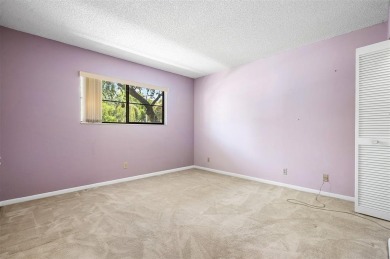 DRASTICALLY REDUCED! ESTATE SALE, This in-demand first floor 2 on Woodmont Country Club in Florida - for sale on GolfHomes.com, golf home, golf lot