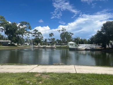 Lovely two-bedroom two bath home with lake views.  This home on Lake Fairways Country Club in Florida - for sale on GolfHomes.com, golf home, golf lot