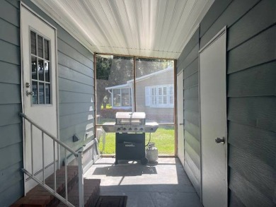 Lovely two-bedroom two bath home with lake views.  This home on Lake Fairways Country Club in Florida - for sale on GolfHomes.com, golf home, golf lot