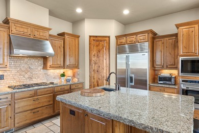 This gorgeous home blends indoors and outdoors with the many on Entrada at Snow Canyon in Utah - for sale on GolfHomes.com, golf home, golf lot