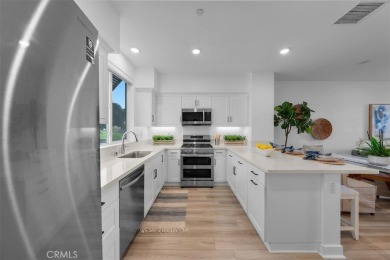 Experience modern luxury in this pristine Anaheim townhome on Dad Miller Golf Course in California - for sale on GolfHomes.com, golf home, golf lot