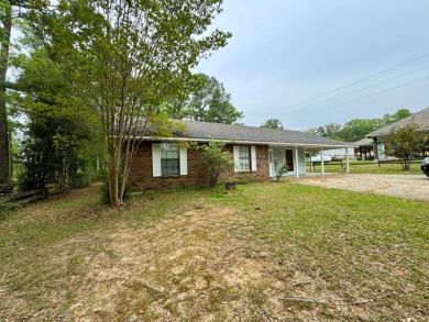 This charming brick home is nestled on 1 acre in a peaceful area on Cypress Bend Golf Resort in Louisiana - for sale on GolfHomes.com, golf home, golf lot