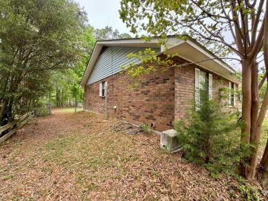 This charming brick home is nestled on 1 acre in a peaceful area on Cypress Bend Golf Resort in Louisiana - for sale on GolfHomes.com, golf home, golf lot