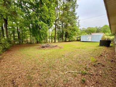 This charming brick home is nestled on 1 acre in a peaceful area on Cypress Bend Golf Resort in Louisiana - for sale on GolfHomes.com, golf home, golf lot