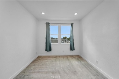 Experience modern luxury in this pristine Anaheim townhome on Dad Miller Golf Course in California - for sale on GolfHomes.com, golf home, golf lot