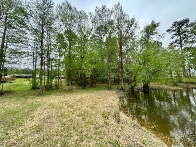 This charming brick home is nestled on 1 acre in a peaceful area on Cypress Bend Golf Resort in Louisiana - for sale on GolfHomes.com, golf home, golf lot