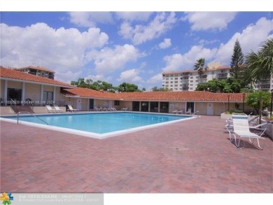 This well-maintained condo, ideally located close to highways on Woodlands Country Club in Florida - for sale on GolfHomes.com, golf home, golf lot