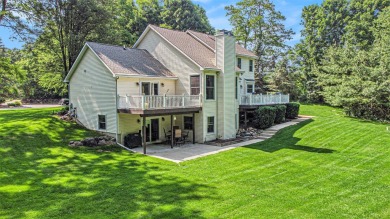 This terrific contemporary home gets a retreat like setting in on Whispering Pines Golf  in Michigan - for sale on GolfHomes.com, golf home, golf lot