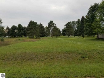 Buildable lot on 13th fairway of The Pines golf course in on The Pines Golf Course at Lake Isabella in Michigan - for sale on GolfHomes.com, golf home, golf lot