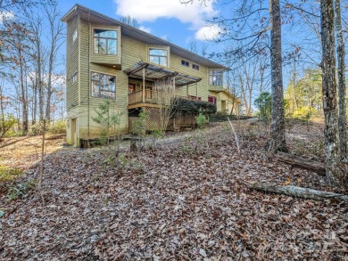 Modern farmhouse meets contemporary chic in this beautiful on Rumbling Bald Resort on Lake Lure in North Carolina - for sale on GolfHomes.com, golf home, golf lot