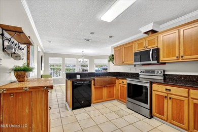 Beautifully maintained and move-in ready on a quiet Diamondhead on Diamondhead Country Club in Mississippi - for sale on GolfHomes.com, golf home, golf lot