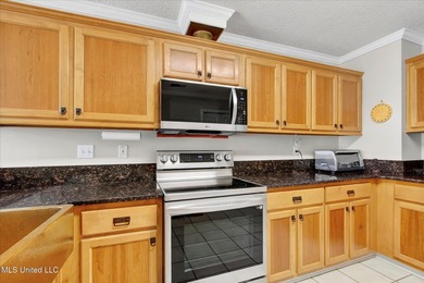 Beautifully maintained and move-in ready on a quiet Diamondhead on Diamondhead Country Club in Mississippi - for sale on GolfHomes.com, golf home, golf lot