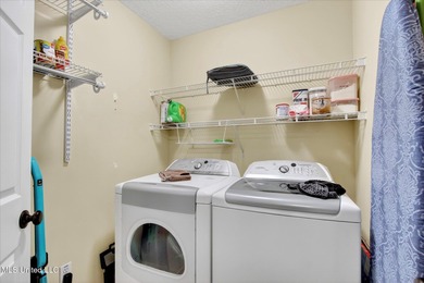 Beautifully maintained and move-in ready on a quiet Diamondhead on Diamondhead Country Club in Mississippi - for sale on GolfHomes.com, golf home, golf lot