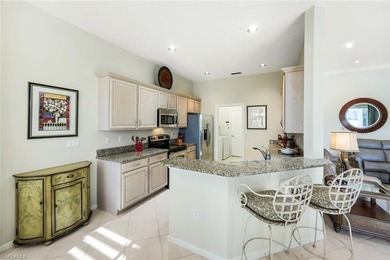 This impeccably maintained residence is nestled within Laurel on Shadow Wood Country Club in Florida - for sale on GolfHomes.com, golf home, golf lot