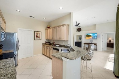 This impeccably maintained residence is nestled within Laurel on Shadow Wood Country Club in Florida - for sale on GolfHomes.com, golf home, golf lot