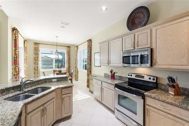 This impeccably maintained residence is nestled within Laurel on Shadow Wood Country Club in Florida - for sale on GolfHomes.com, golf home, golf lot