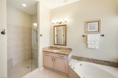 This impeccably maintained residence is nestled within Laurel on Shadow Wood Country Club in Florida - for sale on GolfHomes.com, golf home, golf lot