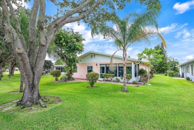 Welcome to this charming 2-bedroom, 2-bathroom home located in a on Cypress Lakes Golf Course - West Palm Beach in Florida - for sale on GolfHomes.com, golf home, golf lot