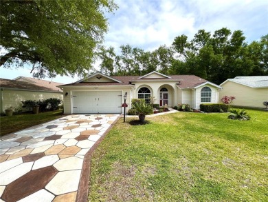 Beautiful home with a large Florida room overlooking a golf on Plantation Golf Club in Florida - for sale on GolfHomes.com, golf home, golf lot