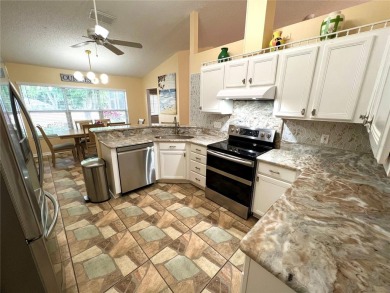 Beautiful home with a large Florida room overlooking a golf on Plantation Golf Club in Florida - for sale on GolfHomes.com, golf home, golf lot