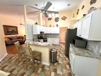 Beautiful home with a large Florida room overlooking a golf on Plantation Golf Club in Florida - for sale on GolfHomes.com, golf home, golf lot