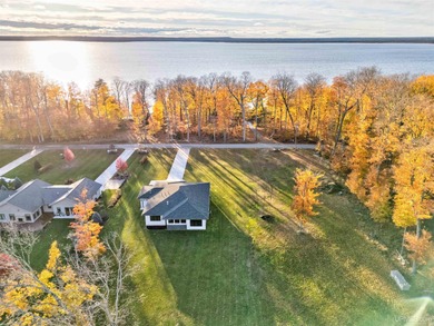 Experience refined modern living in this stunning 2025 on Indian Lake Golf and Country Club in Michigan - for sale on GolfHomes.com, golf home, golf lot