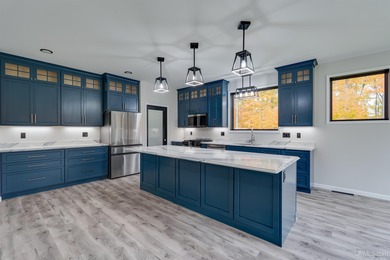 Experience refined modern living in this stunning 2025 on Indian Lake Golf and Country Club in Michigan - for sale on GolfHomes.com, golf home, golf lot