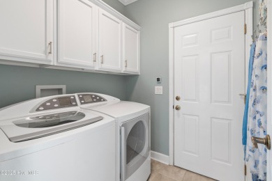 Enjoy living in this updated, custom built, classic low country on Members Club At St. James Plantation in North Carolina - for sale on GolfHomes.com, golf home, golf lot
