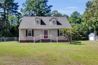 Beautiful 3-bedroom, 2-bathroom home tucked away on nearly an on Minnesott Golf and Country Club in North Carolina - for sale on GolfHomes.com, golf home, golf lot