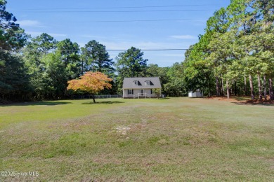 Beautiful 3-bedroom, 2-bathroom home tucked away on nearly an on Minnesott Golf and Country Club in North Carolina - for sale on GolfHomes.com, golf home, golf lot