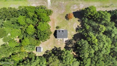 Beautiful 3-bedroom, 2-bathroom home tucked away on nearly an on Minnesott Golf and Country Club in North Carolina - for sale on GolfHomes.com, golf home, golf lot