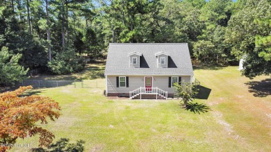 Beautiful 3-bedroom, 2-bathroom home tucked away on nearly an on Minnesott Golf and Country Club in North Carolina - for sale on GolfHomes.com, golf home, golf lot