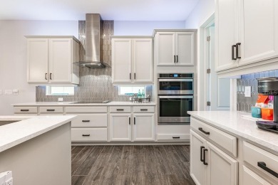 Under contract-accepting backup offers. Built in 2021 and better on Eagle Creek Golf Club in Florida - for sale on GolfHomes.com, golf home, golf lot