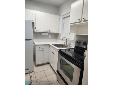 Updated 1st floor condo with golf course views on 5th green on Leisureville Community Association in Florida - for sale on GolfHomes.com, golf home, golf lot