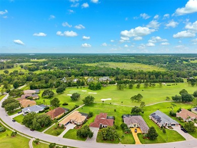 Exquisite Golf Course Living at 13049 Thoroughbred Drive, Dade on Lake Jovita Golf and Country Club in Florida - for sale on GolfHomes.com, golf home, golf lot