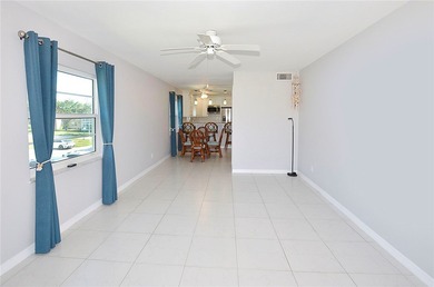 Remodeled end unit w/ serene golf/lake views, tons of natural on The American Golf Club in Florida - for sale on GolfHomes.com, golf home, golf lot