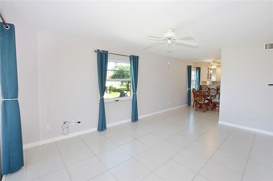 Remodeled end unit w/ serene golf/lake views, tons of natural on The American Golf Club in Florida - for sale on GolfHomes.com, golf home, golf lot