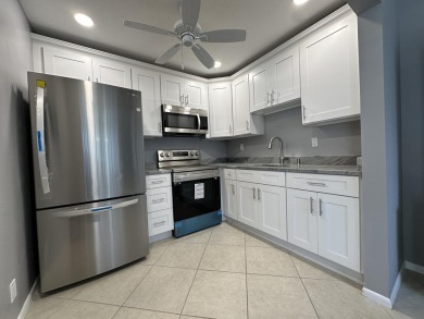 Beautifully Renovated Unit withNew White Shaker Style Kitchen on Addison Reserve in Florida - for sale on GolfHomes.com, golf home, golf lot