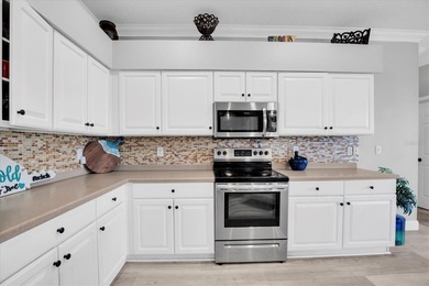 Welcome to your slice of Florida paradise in the guard gated on The Eagles Golf Course and Club in Florida - for sale on GolfHomes.com, golf home, golf lot