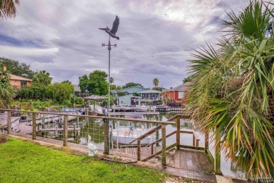 Welcome to this stunning home in the Santa Rosa Shores Canal on Tiger Point Golf and Country Club in Florida - for sale on GolfHomes.com, golf home, golf lot