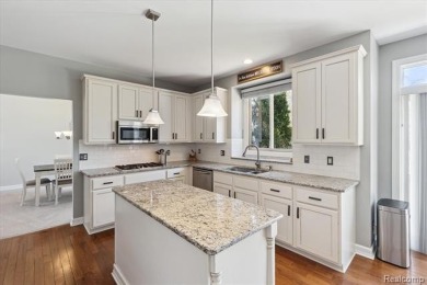 Step into this stunning 4-bedroom brick colonial located in the on Oakhurst Golf and Country Club in Michigan - for sale on GolfHomes.com, golf home, golf lot