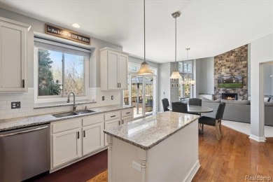 Step into this stunning 4-bedroom brick colonial located in the on Oakhurst Golf and Country Club in Michigan - for sale on GolfHomes.com, golf home, golf lot