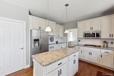 Step into this stunning 4-bedroom brick colonial located in the on Oakhurst Golf and Country Club in Michigan - for sale on GolfHomes.com, golf home, golf lot