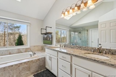 Step into this stunning 4-bedroom brick colonial located in the on Oakhurst Golf and Country Club in Michigan - for sale on GolfHomes.com, golf home, golf lot