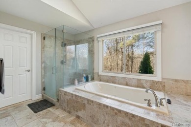 Step into this stunning 4-bedroom brick colonial located in the on Oakhurst Golf and Country Club in Michigan - for sale on GolfHomes.com, golf home, golf lot