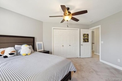 Step into this stunning 4-bedroom brick colonial located in the on Oakhurst Golf and Country Club in Michigan - for sale on GolfHomes.com, golf home, golf lot